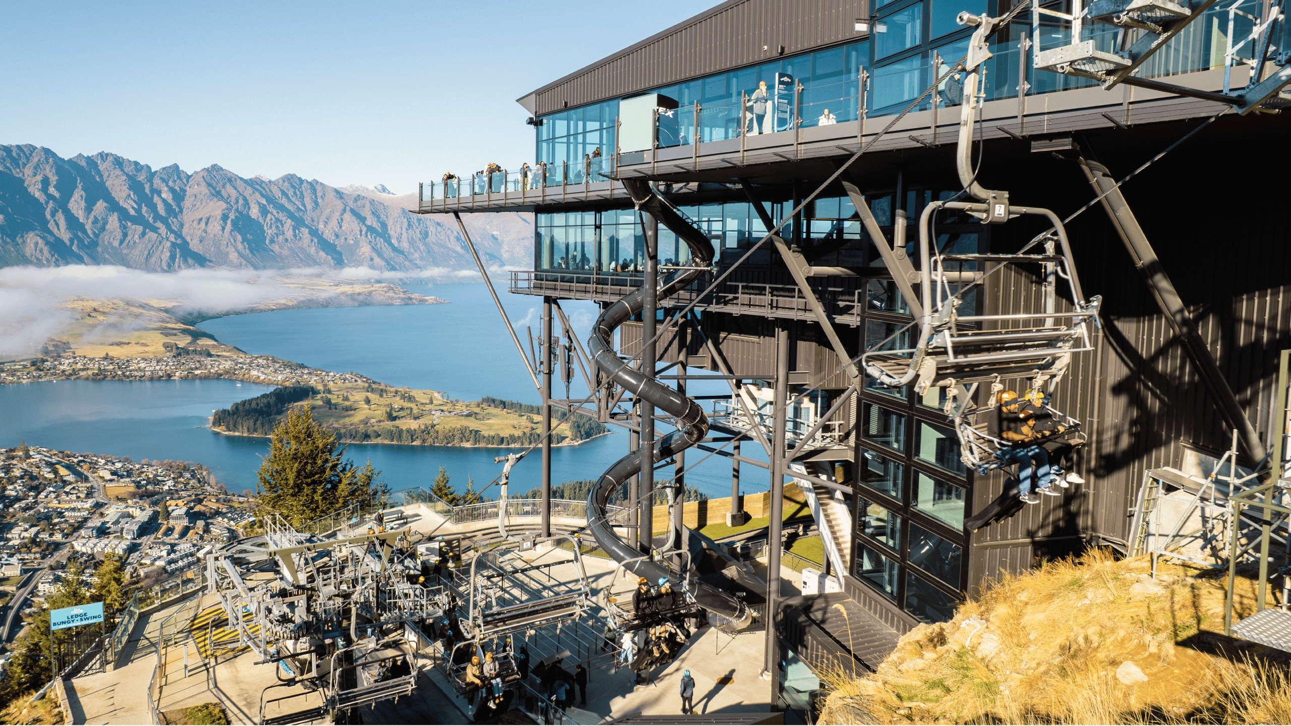 Skyline Queenstown gondola terminal and Vortex Slide overlooking Lake Wakatipu and the Remarkables.