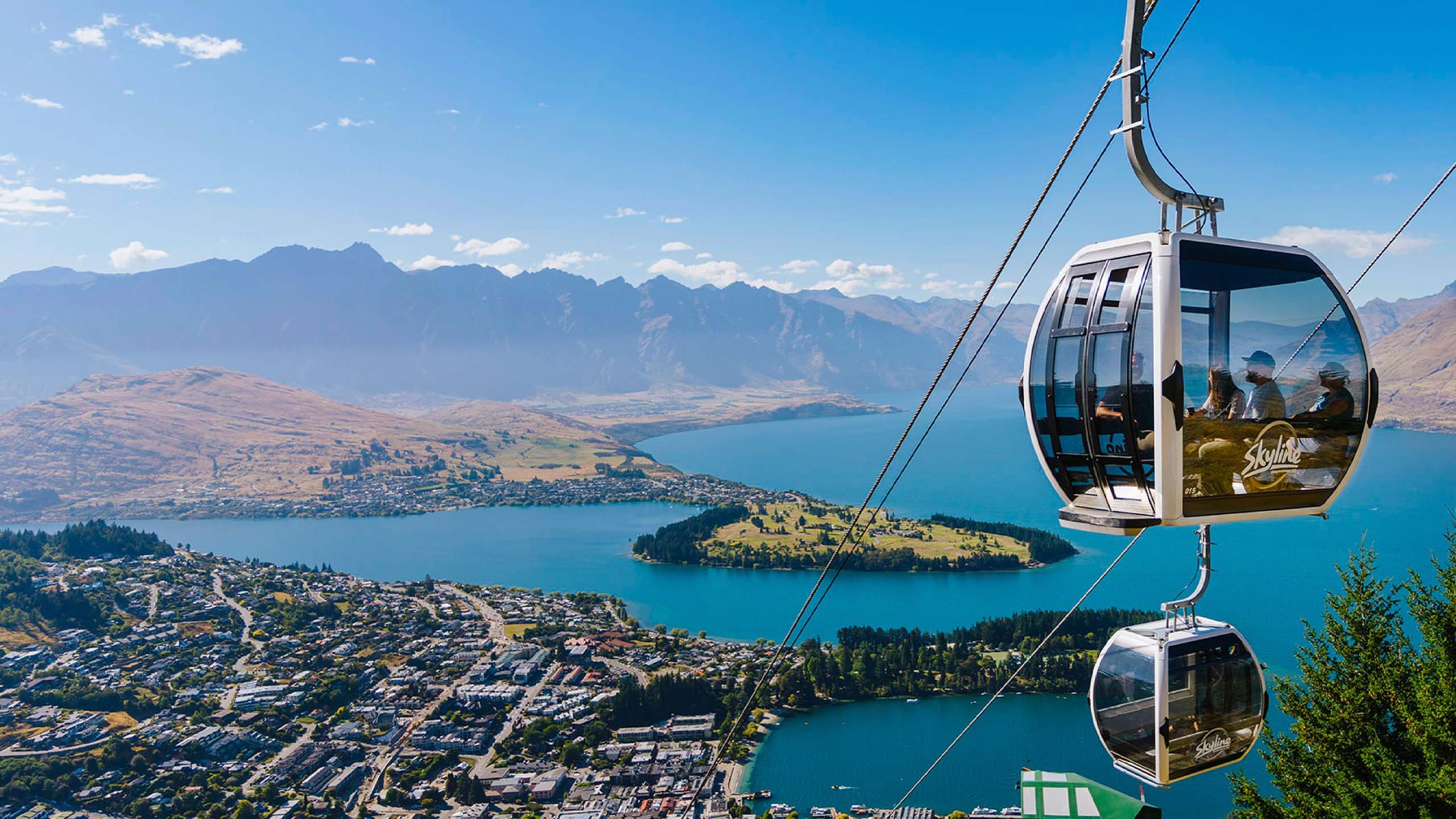 Skyline Queenstown Gondola overlooking Lake Wakatipu, Queenstown, New Zealand with panoramic mountain views.