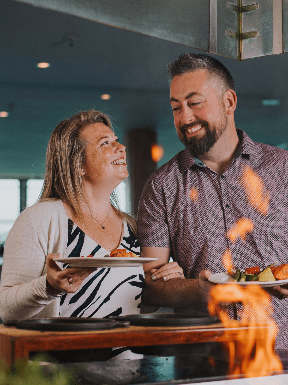 Couple enjoying food at Stratosfare Queenstown