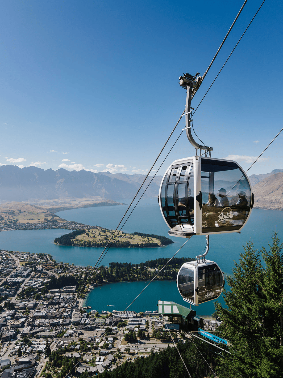 Skyline Queenstown Gondola cabins overlooking Queenstown