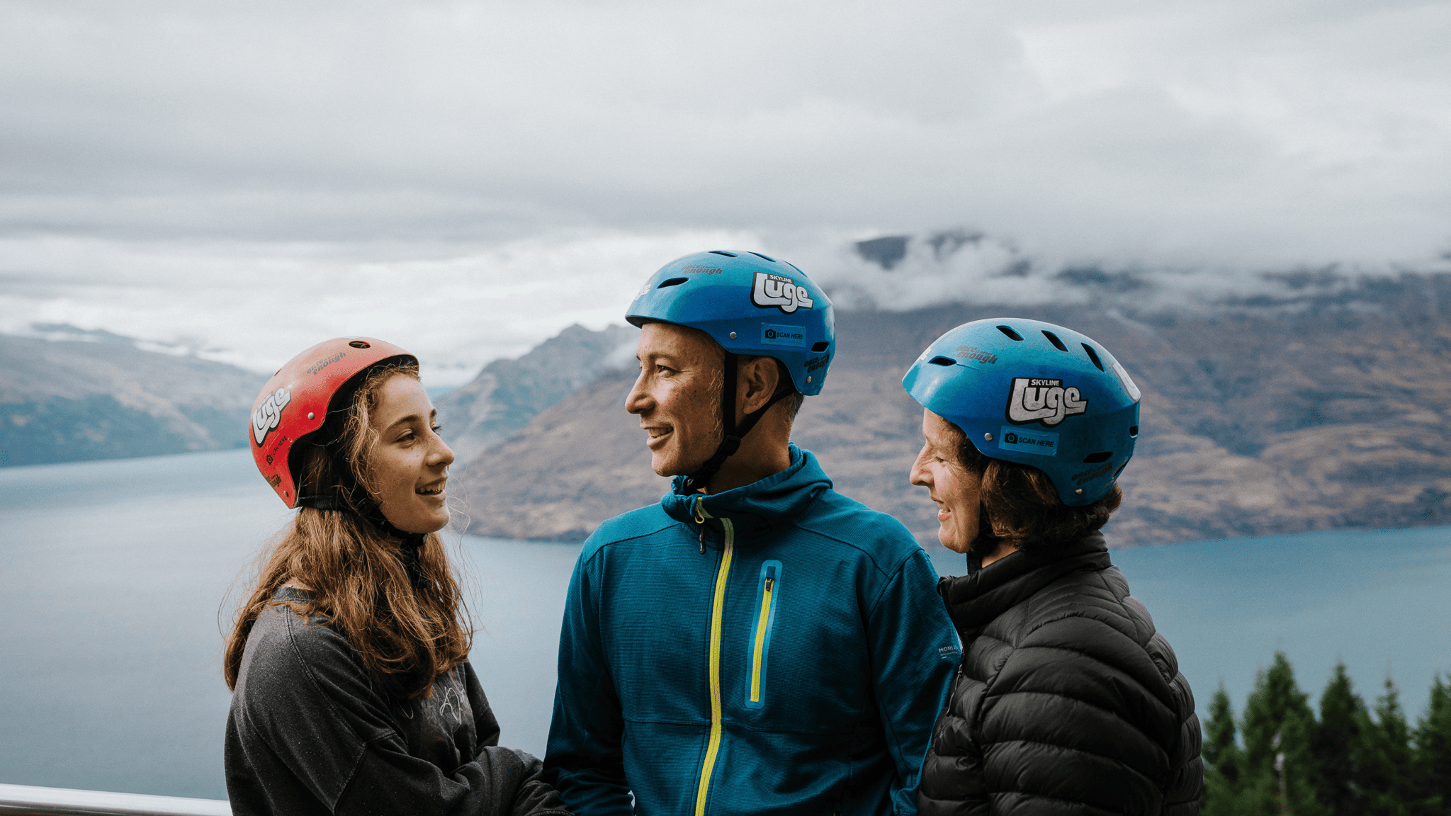 Family laughing together at the top of the Queenstown Luge