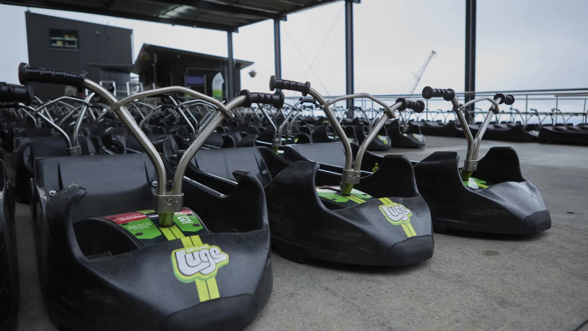 Rows of retired Skyline Queenstown Luge carts awaiting collection for recycling.