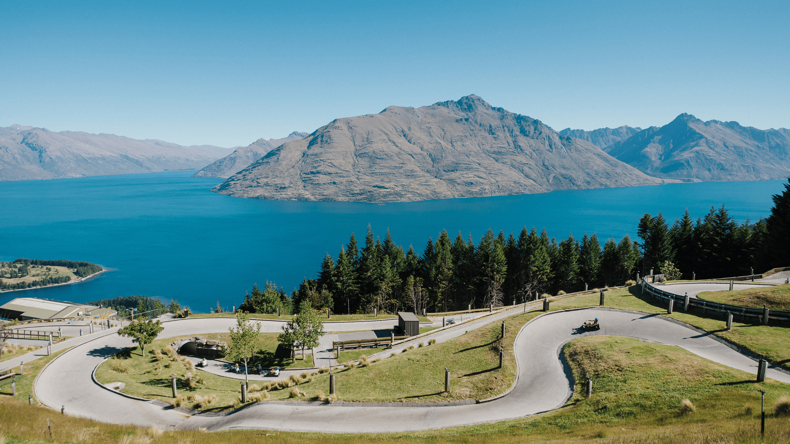 Image of the track with mountains and water in the background
